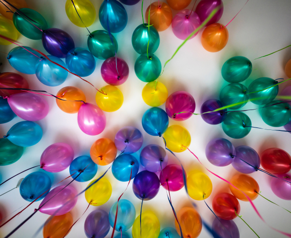 various coloured balloons on white ceiling