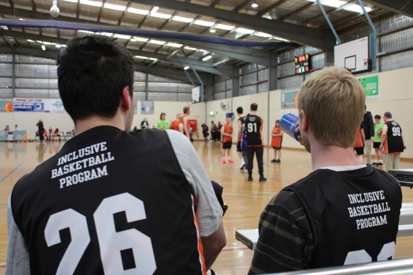 Access4u customers Kurt and Nick watching an inclusive basketball game
