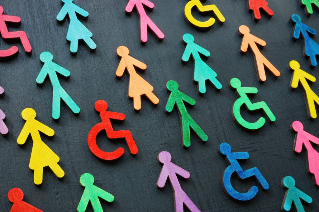 Colorful figurines of all abilities on a dark surface