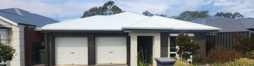 Wycombe Drive header image, white roof and garage with dark bricks
